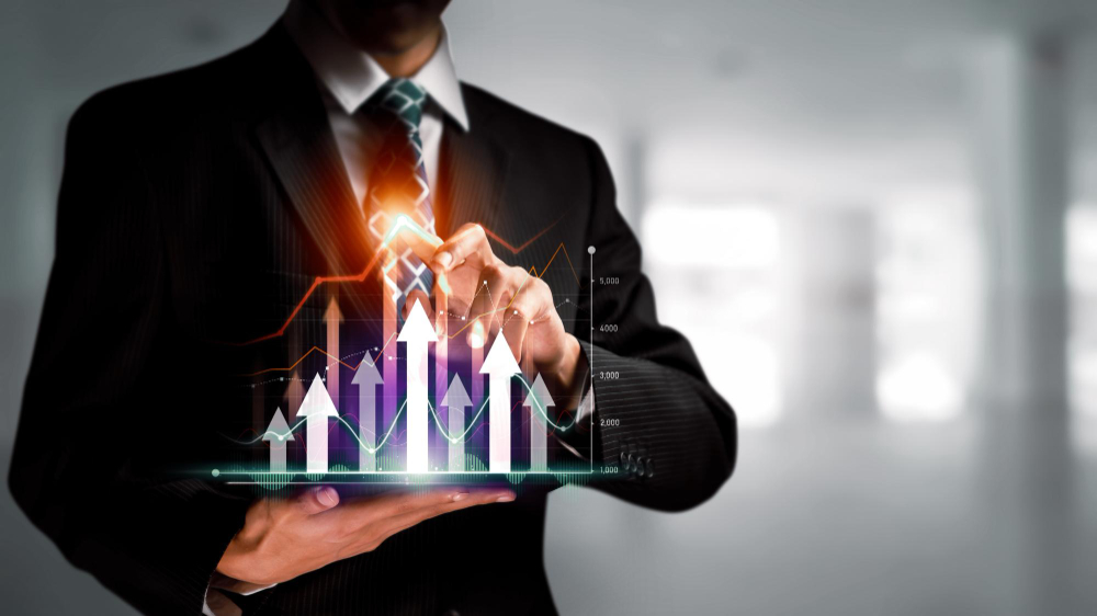 Business owner with a rising financial chart